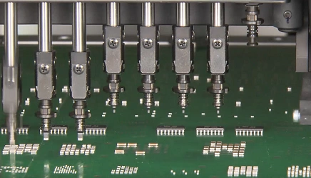 Automated PCB assembly line placing components in a precision hardware manufacturing process.